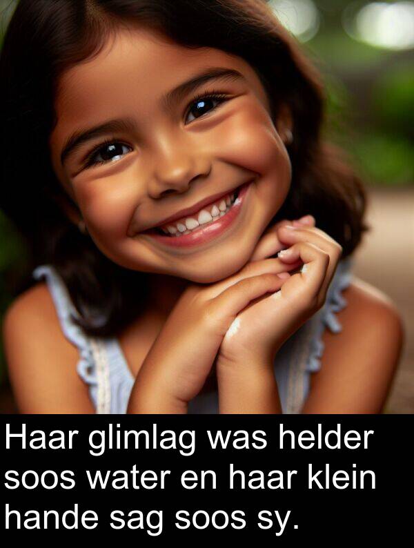 hande: Haar glimlag was helder soos water en haar klein hande sag soos sy.