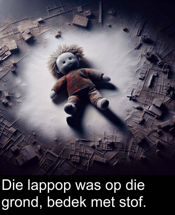 was: Die lappop was op die grond, bedek met stof.
