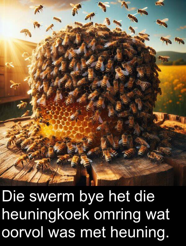 heuning: Die swerm bye het die heuningkoek omring wat oorvol was met heuning.