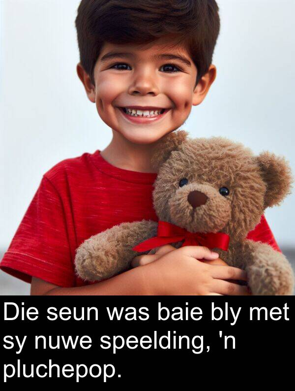 seun: Die seun was baie bly met sy nuwe speelding, 'n pluchepop.