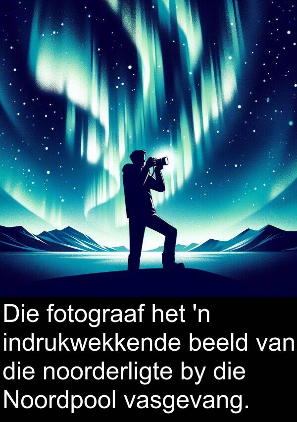 beeld: Die fotograaf het 'n indrukwekkende beeld van die noorderligte by die Noordpool vasgevang.