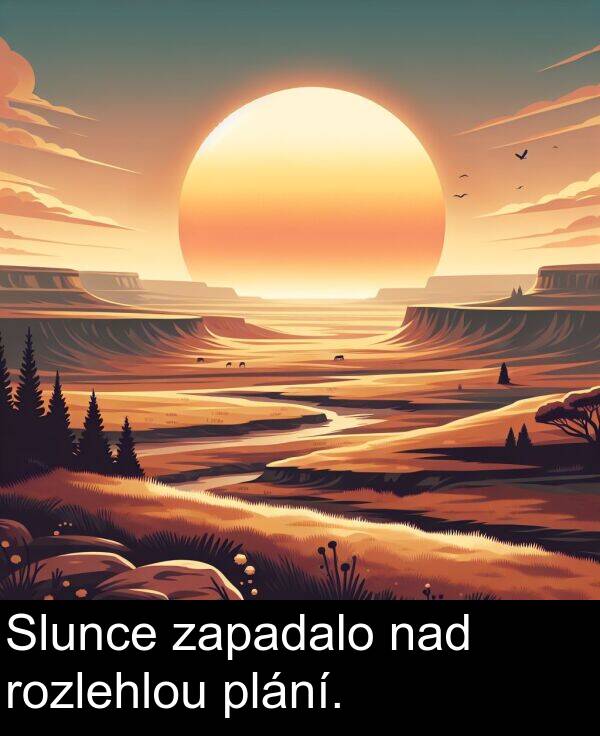nad: Slunce zapadalo nad rozlehlou plání.