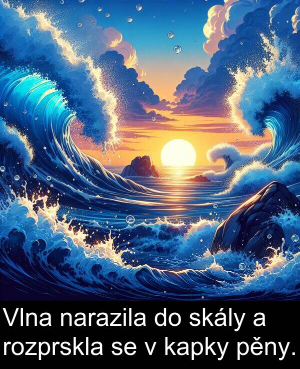 kapky: Vlna narazila do skály a rozprskla se v kapky pěny.