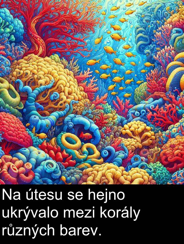 hejno: Na útesu se hejno ukrývalo mezi korály různých barev.