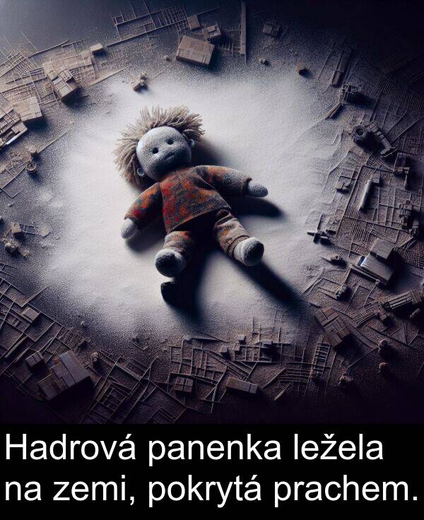 panenka: Hadrová panenka ležela na zemi, pokrytá prachem.