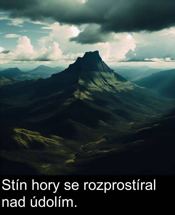 nad: Stín hory se rozprostíral nad údolím.