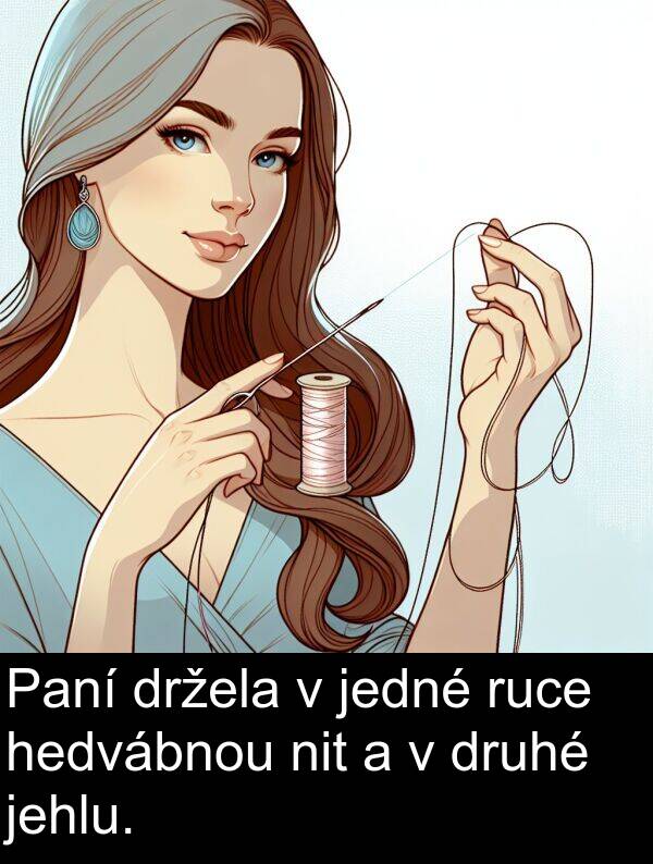 hedvábnou: Paní držela v jedné ruce hedvábnou nit a v druhé jehlu.
