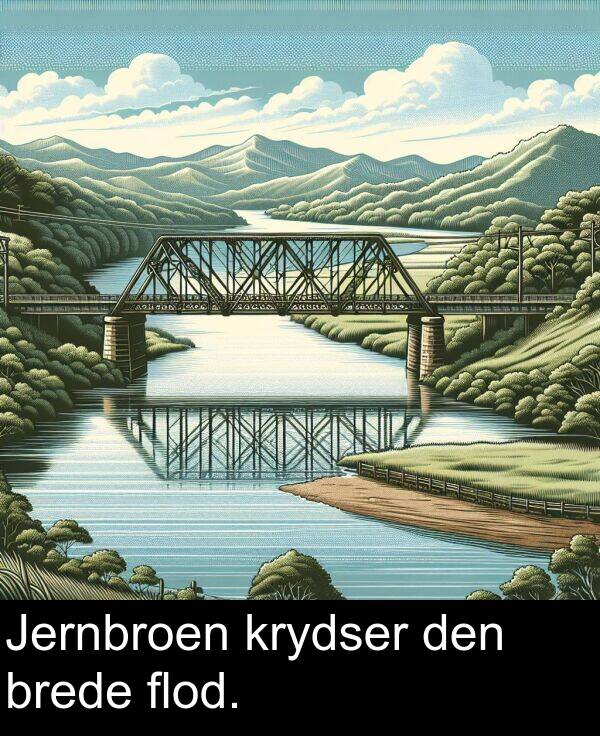 krydser: Jernbroen krydser den brede flod.