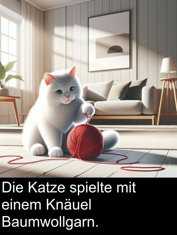spielte: Die Katze spielte mit einem Knäuel Baumwollgarn.