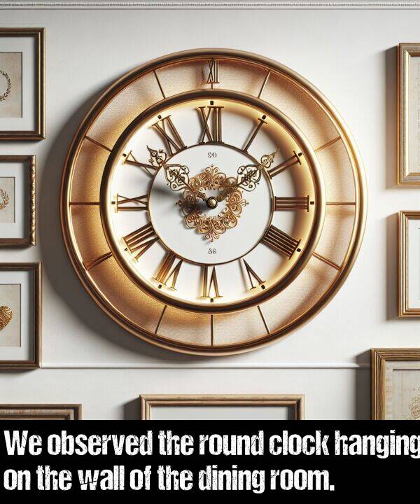 wall: We observed the round clock hanging on the wall of the dining room.