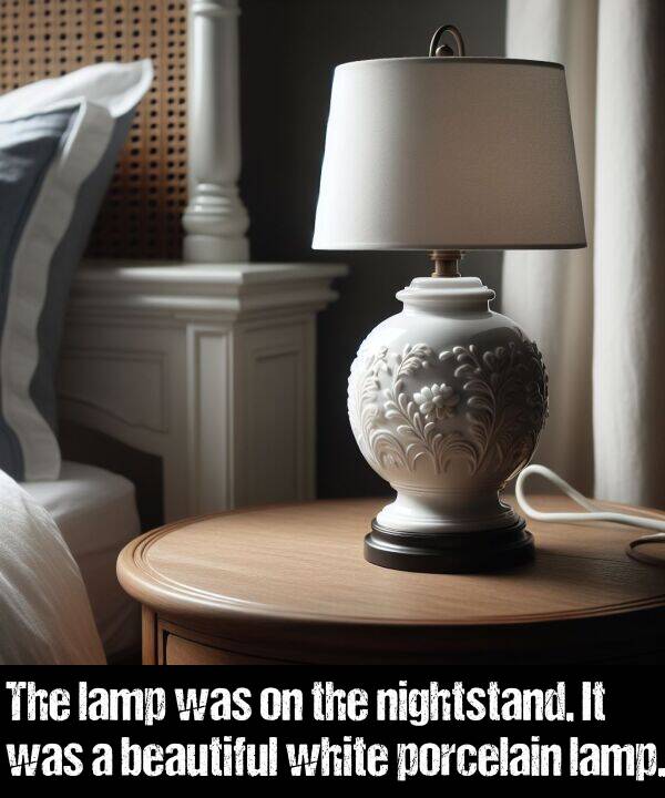 lamp: The lamp was on the nightstand. It was a beautiful white porcelain lamp.