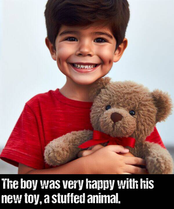boy: The boy was very happy with his new toy, a stuffed animal.