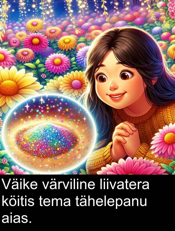 tähelepanu: Väike värviline liivatera köitis tema tähelepanu aias.