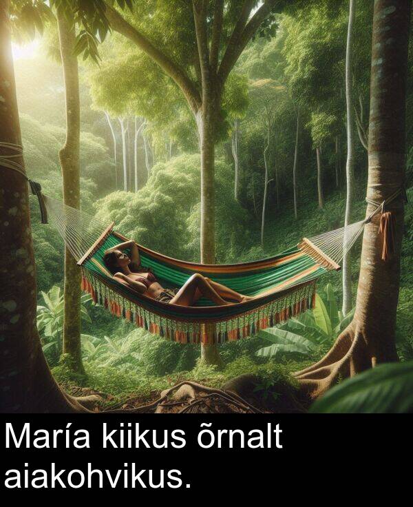 aiakohvikus: María kiikus õrnalt aiakohvikus.
