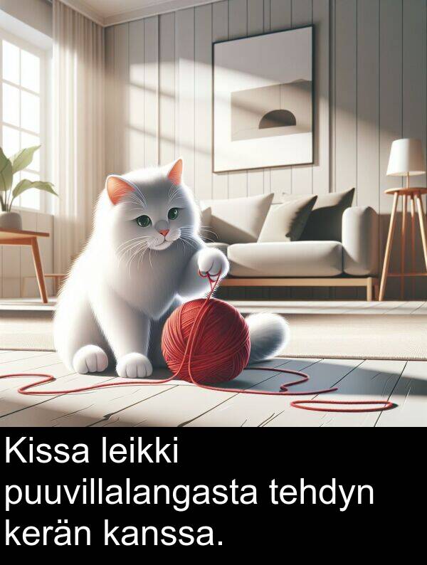 puuvillalangasta: Kissa leikki puuvillalangasta tehdyn kerän kanssa.