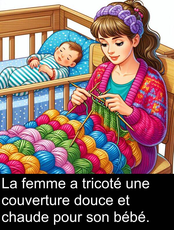 bébé: La femme a tricoté une couverture douce et chaude pour son bébé.