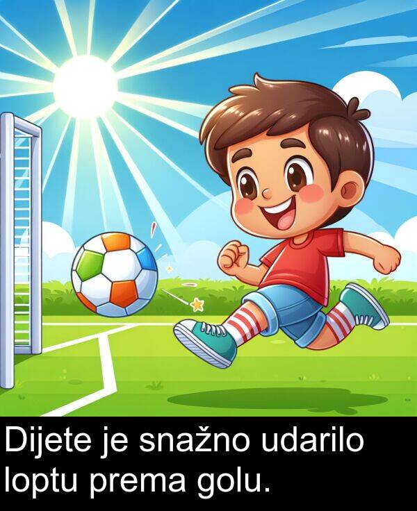 udarilo: Dijete je snažno udarilo loptu prema golu.