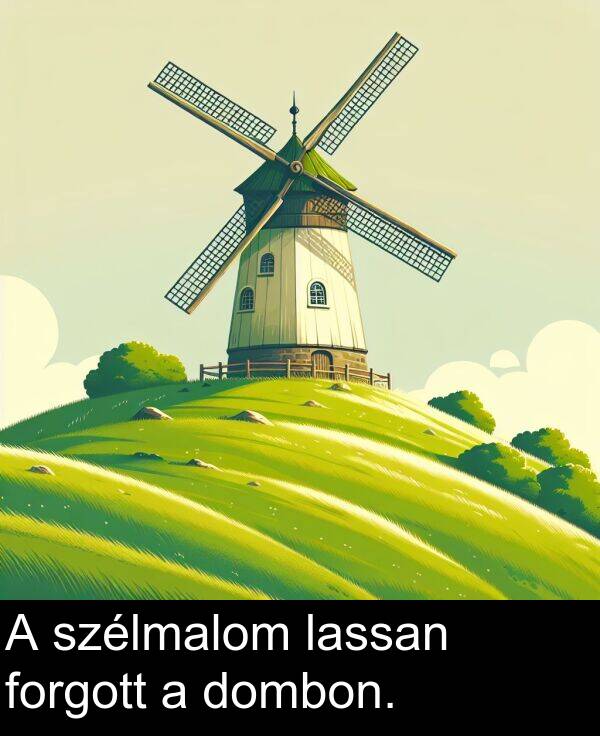 dombon: A szélmalom lassan forgott a dombon.