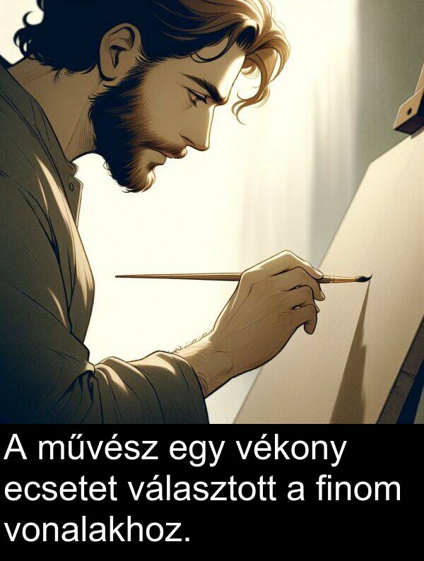 művész: A művész egy vékony ecsetet választott a finom vonalakhoz.