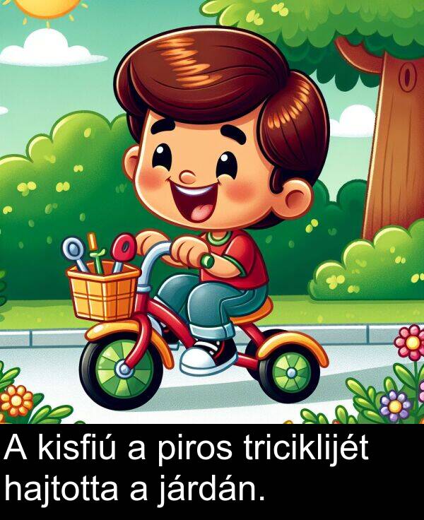 járdán: A kisfiú a piros triciklijét hajtotta a járdán.