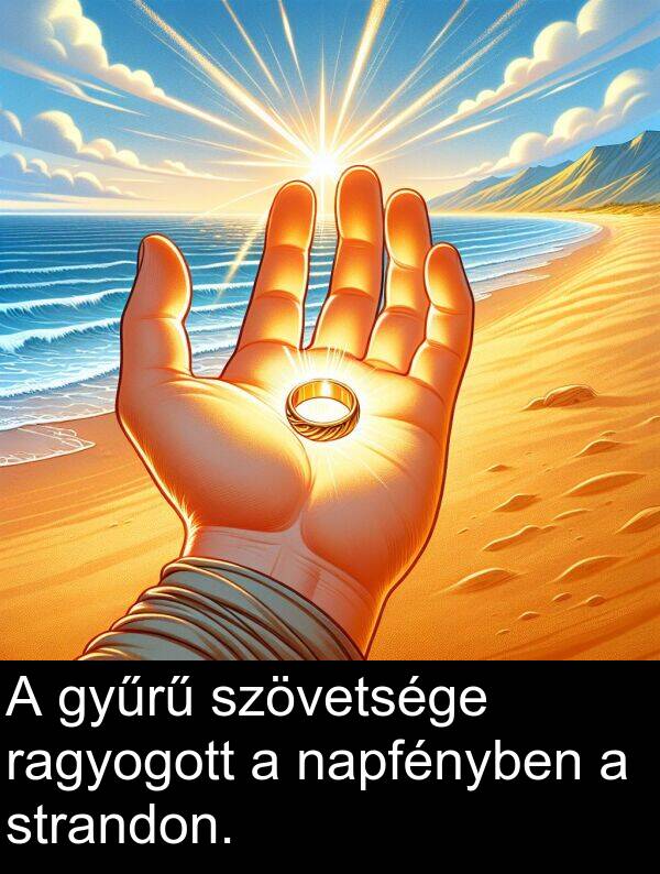 napfényben: A gyűrű szövetsége ragyogott a napfényben a strandon.