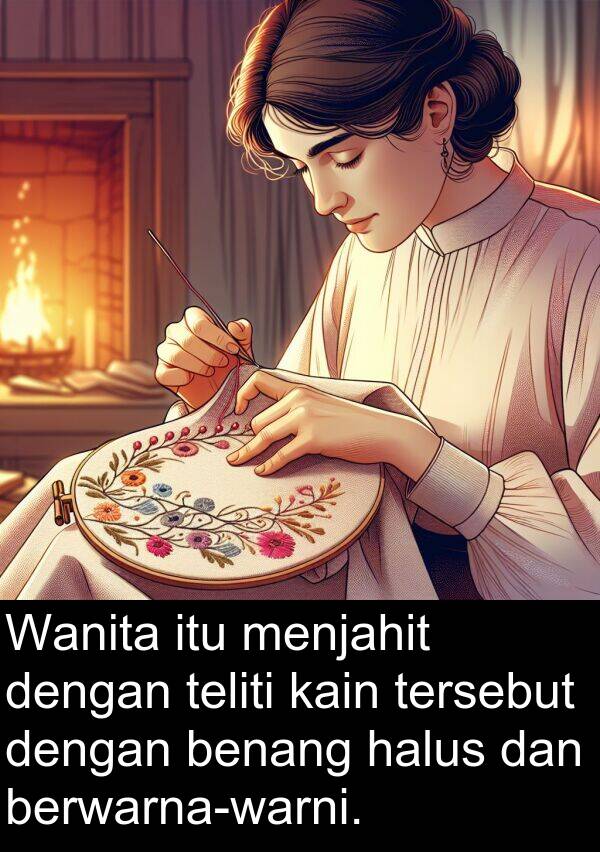 halus: Wanita itu menjahit dengan teliti kain tersebut dengan benang halus dan berwarna-warni.