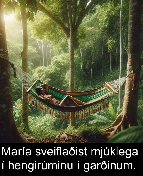 garðinum: María sveiflaðist mjúklega í hengirúminu í garðinum.