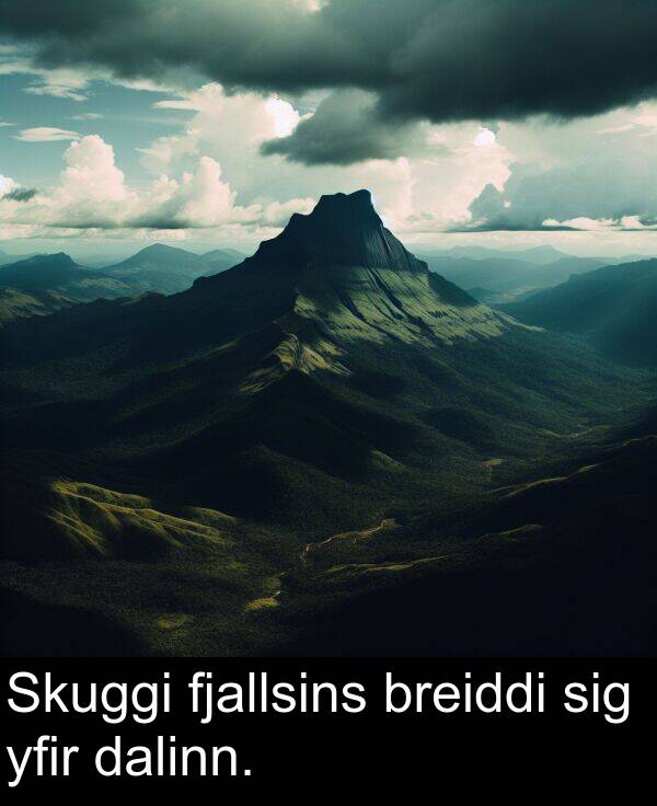 yfir: Skuggi fjallsins breiddi sig yfir dalinn.