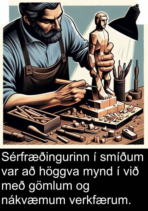 verkfærum: Sérfræðingurinn í smíðum var að höggva mynd í við með gömlum og nákvæmum verkfærum.
