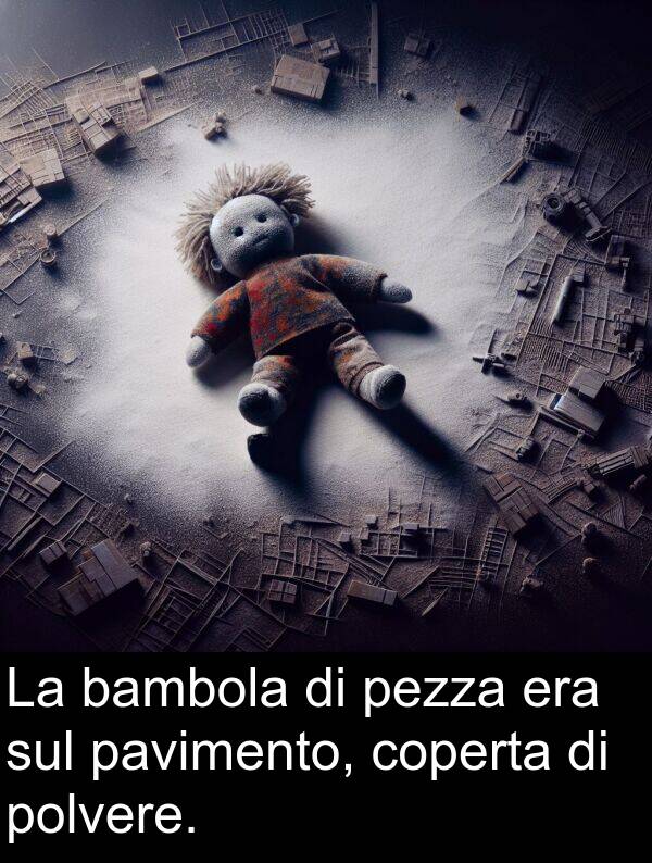 sul: La bambola di pezza era sul pavimento, coperta di polvere.