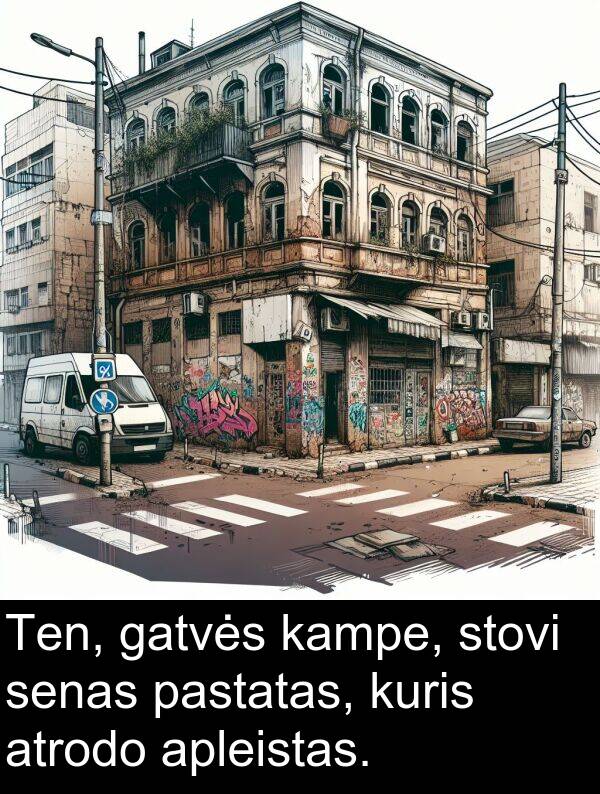 kampe: Ten, gatvės kampe, stovi senas pastatas, kuris atrodo apleistas.