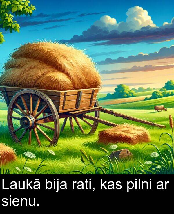 sienu: Laukā bija rati, kas pilni ar sienu.