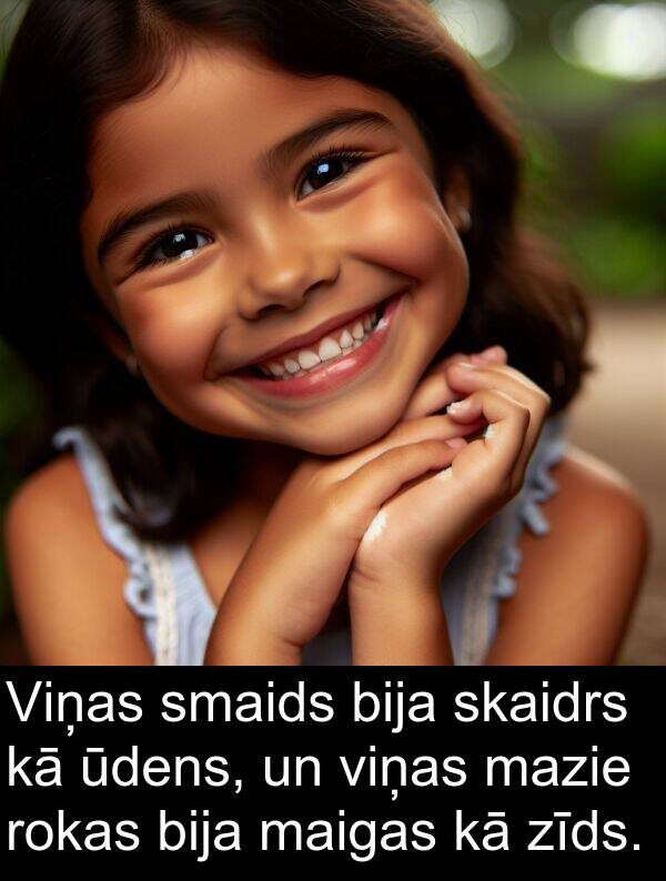 maigas: Viņas smaids bija skaidrs kā ūdens, un viņas mazie rokas bija maigas kā zīds.