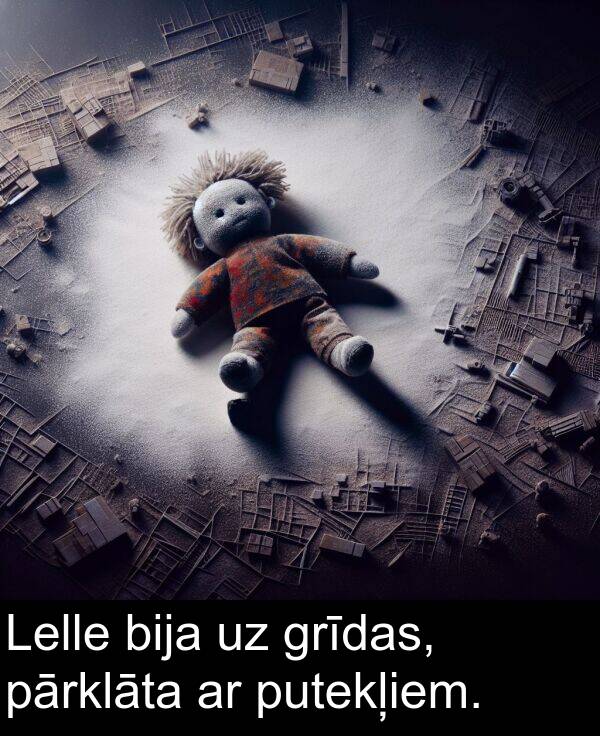 grīdas: Lelle bija uz grīdas, pārklāta ar putekļiem.