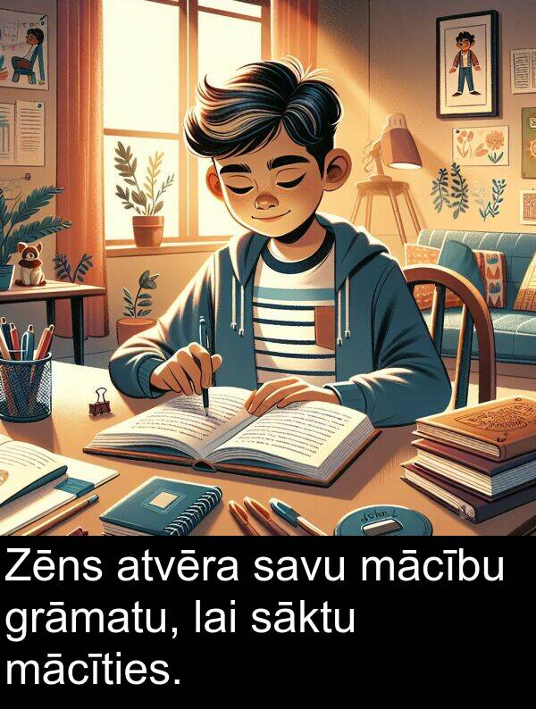 mācību: Zēns atvēra savu mācību grāmatu, lai sāktu mācīties.
