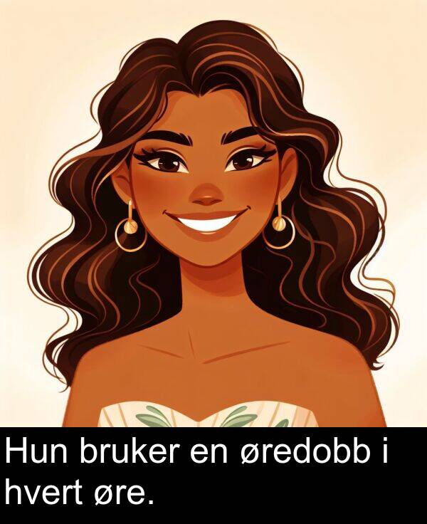 hvert: Hun bruker en øredobb i hvert øre.