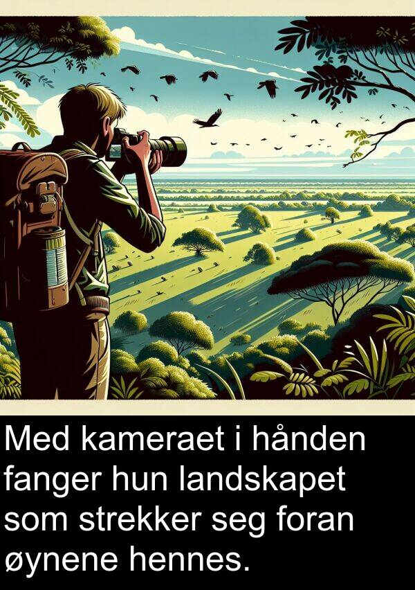 hånden: Med kameraet i hånden fanger hun landskapet som strekker seg foran øynene hennes.