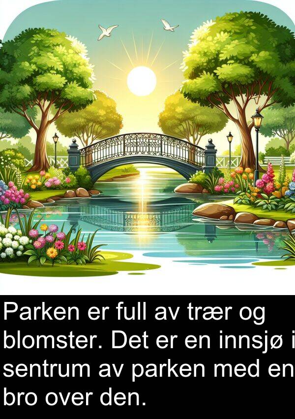 sentrum: Parken er full av trær og blomster. Det er en innsjø i sentrum av parken med en bro over den.