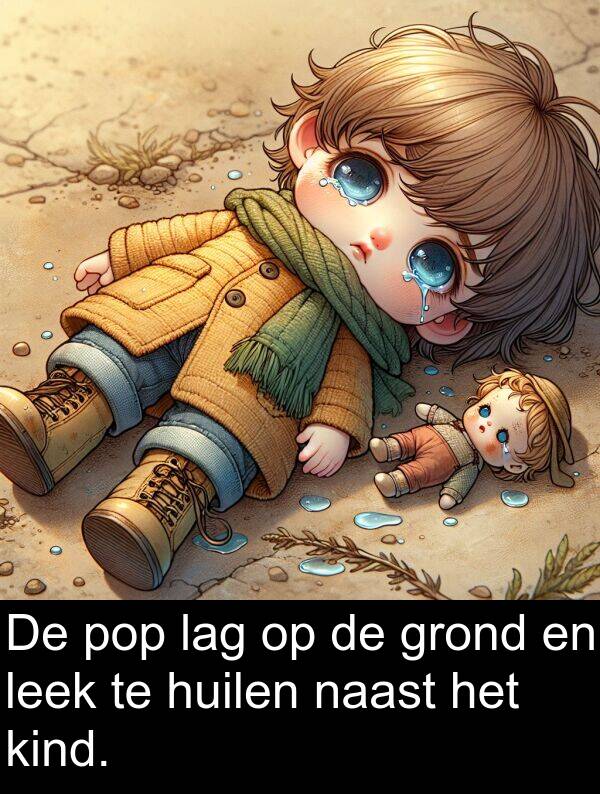 grond: De pop lag op de grond en leek te huilen naast het kind.