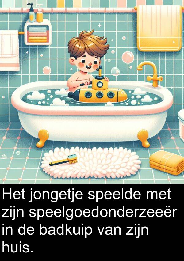 speelgoedonderzeeër: Het jongetje speelde met zijn speelgoedonderzeeër in de badkuip van zijn huis.