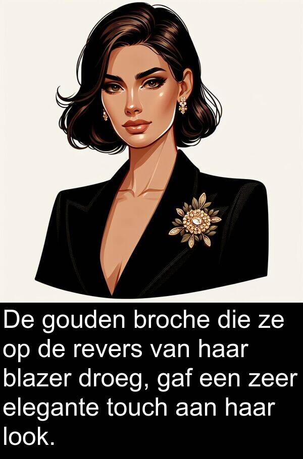 gouden: De gouden broche die ze op de revers van haar blazer droeg, gaf een zeer elegante touch aan haar look.