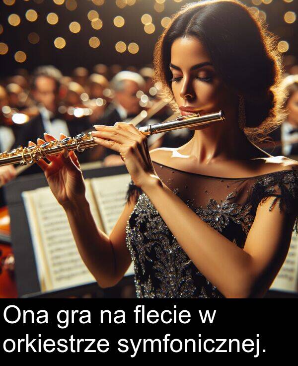 symfonicznej: Ona gra na flecie w orkiestrze symfonicznej.
