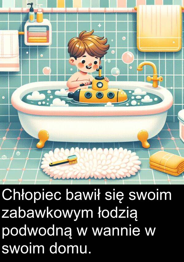 zabawkowym: Chłopiec bawił się swoim zabawkowym łodzią podwodną w wannie w swoim domu.
