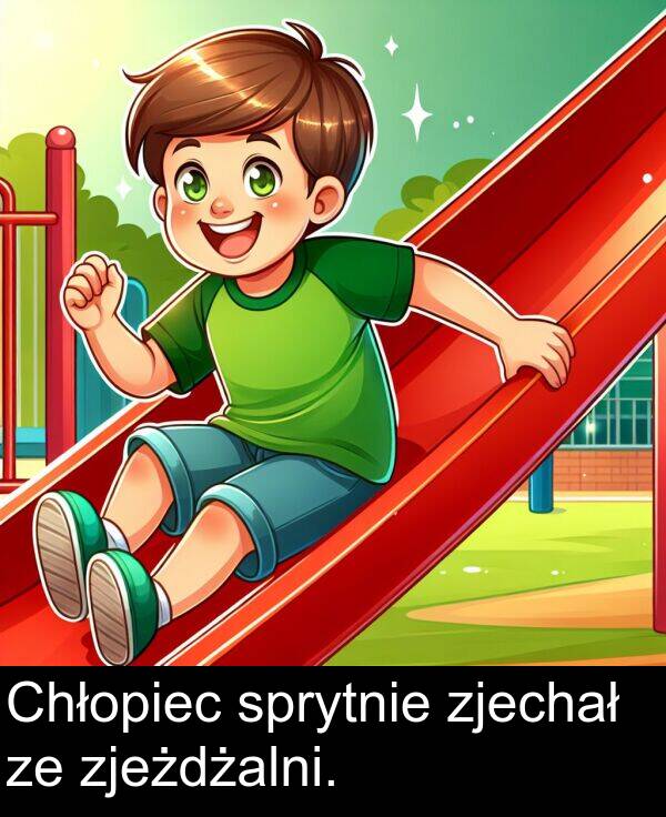 zjeżdżalni: Chłopiec sprytnie zjechał ze zjeżdżalni.