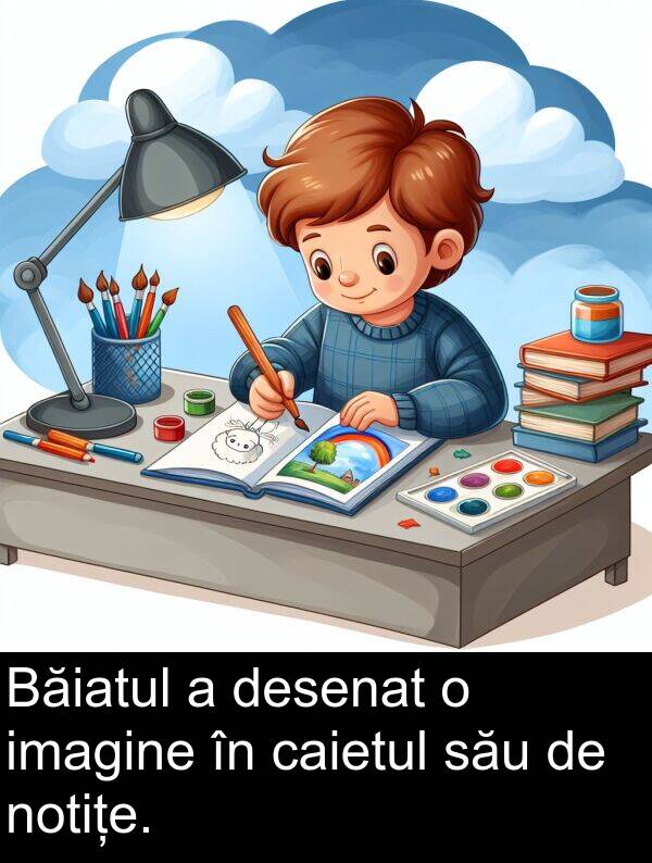 caietul: Băiatul a desenat o imagine în caietul său de notițe.