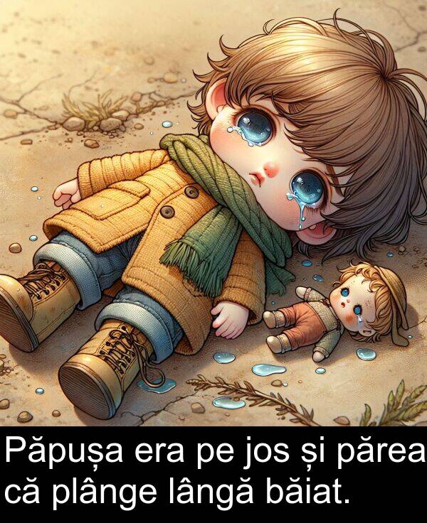 jos: Păpușa era pe jos și părea că plânge lângă băiat.