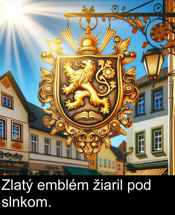 slnkom: Zlatý emblém žiaril pod slnkom.