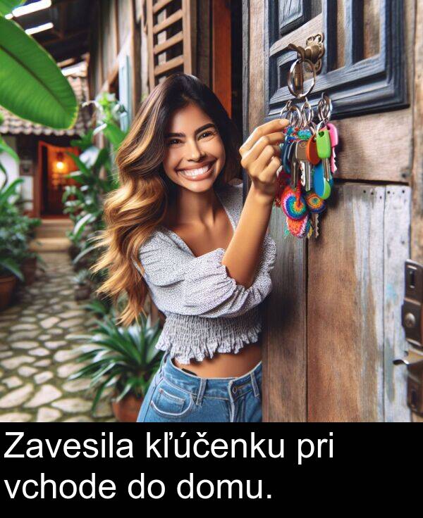 vchode: Zavesila kľúčenku pri vchode do domu.