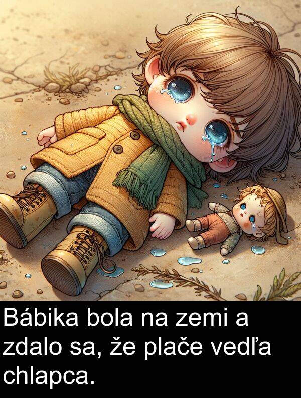 sa: Bábika bola na zemi a zdalo sa, že plače vedľa chlapca.