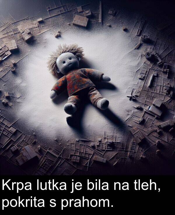 bila: Krpa lutka je bila na tleh, pokrita s prahom.